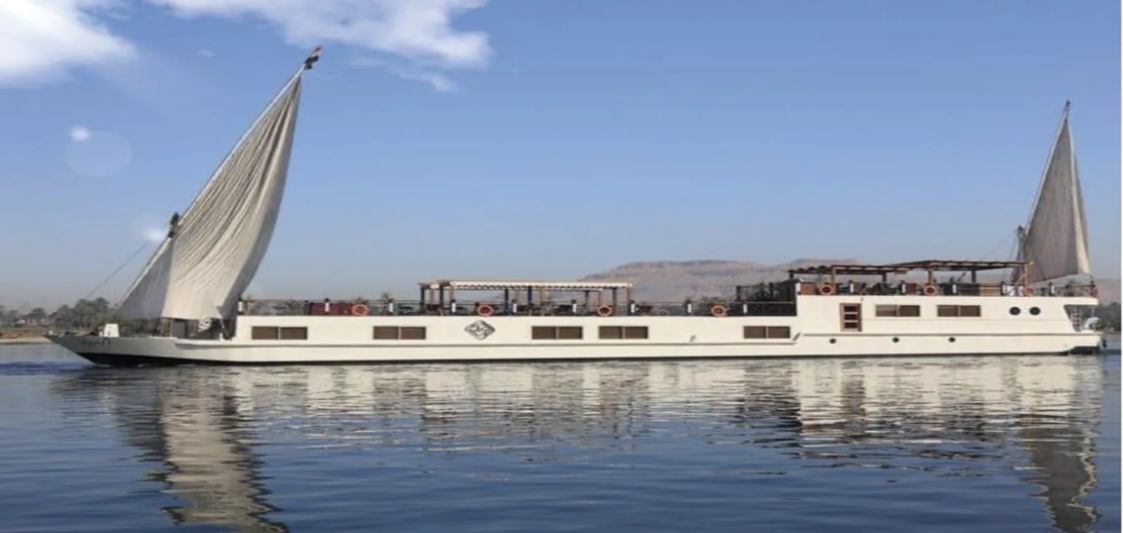 Dahabiya under sail on the Nile